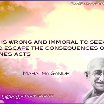 Mahatma Gandhi quote with an image of a purple and orange sky. For Season of Nonviolence 2021