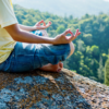Image of a moan barefoot meditating in the mountains outside guided meditation cover image